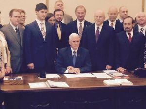 If you're wondering who that guy standing behind Gov. Pence at the signing of the RFRA, his name is Eric Miller. He is the head of the state's latest anti-LGBT organization called "Advance America." They must have used their religious liberty to keep all the black folks out of the room....